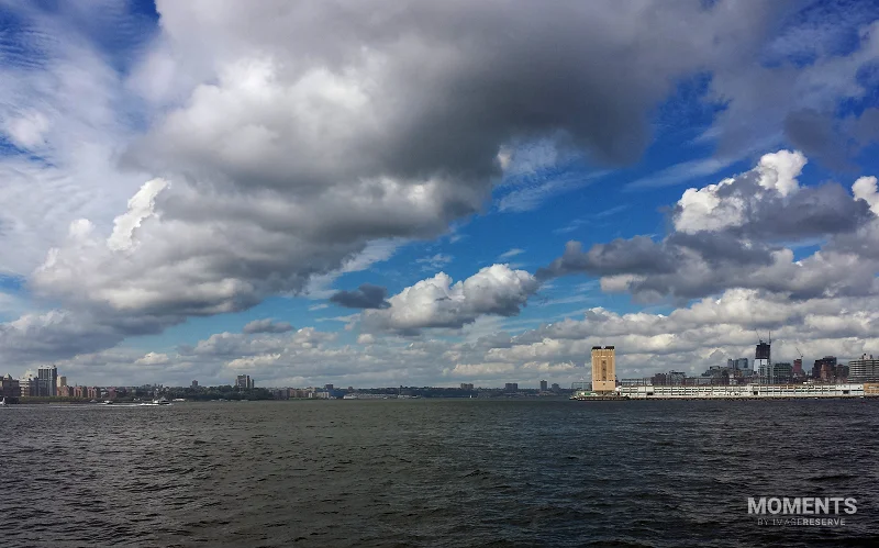Hudson River Estuary and Cityscape under Dramatic Sky