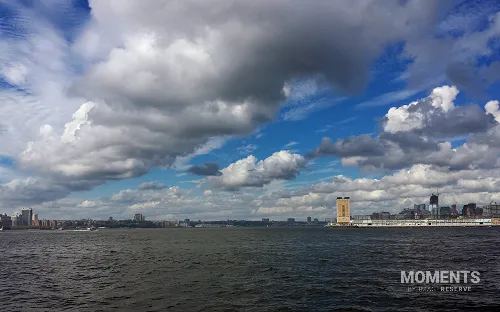 Hudson River Estuary and Cityscape under Dramatic Sky