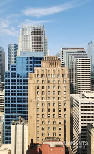 Historic Roanoke Building Amid Modern Chicago Skyscrapers