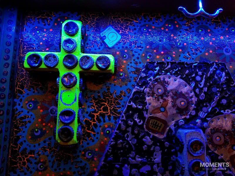 Blacklight Folk Art with Bottle Cap Cross and Skull