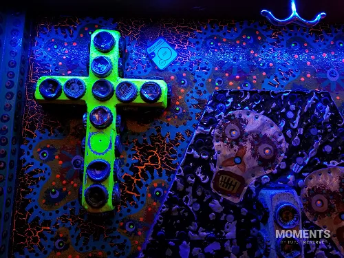 Blacklight Folk Art with Bottle Cap Cross and Skull