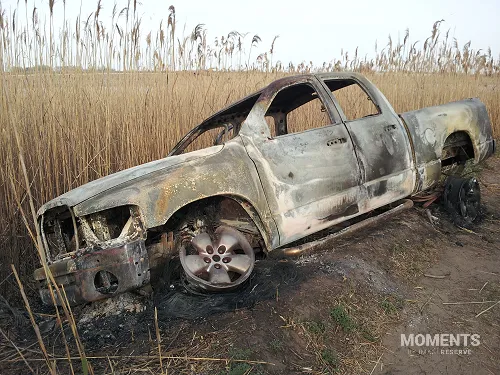 Burned pickup truck abandoned at Gerritsen Creek