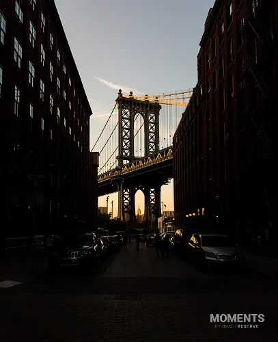 Manhattan Bridge Framed by DUMBO Buildings at Sunset